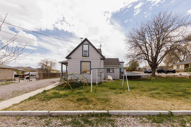 197 West 100 South Redmond, UT 84652 - Photo 5 of 41 View of front of house featuring a playground and a shingled roof