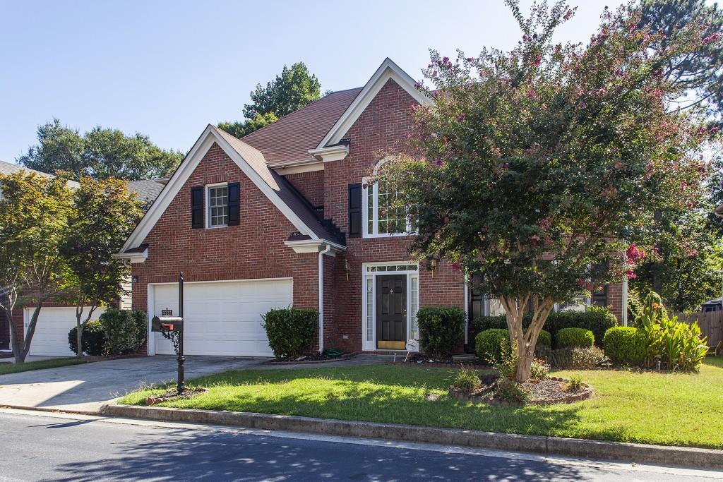 3389 Rose Ridge Atlanta, GA 30340 - Photo 1 of 1 a house that has a tree in front of it