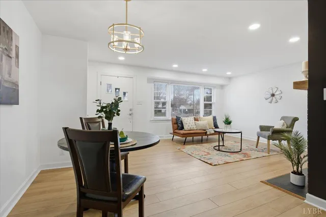 a bedroom with a bed and a view of kitchen