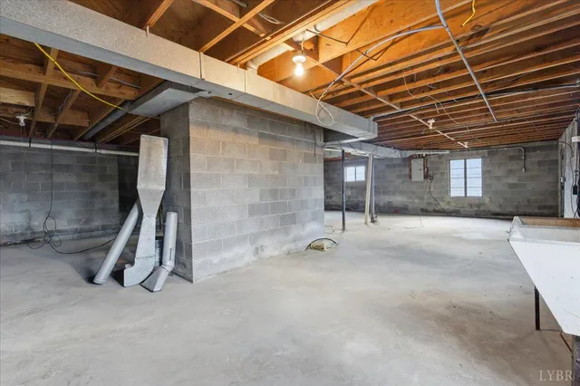 a view of an empty room with wooden roof