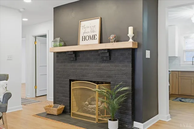 a kitchen with granite countertop a refrigerator stove top oven and sink