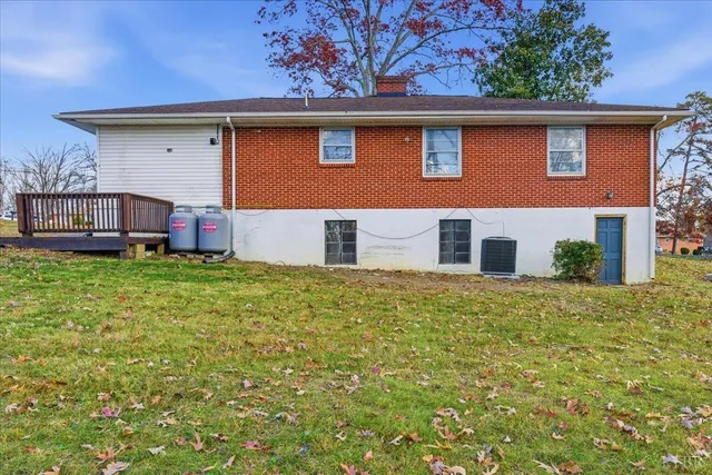 a backyard of a house with large trees