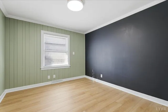 a view of wooden floor and windows in a room