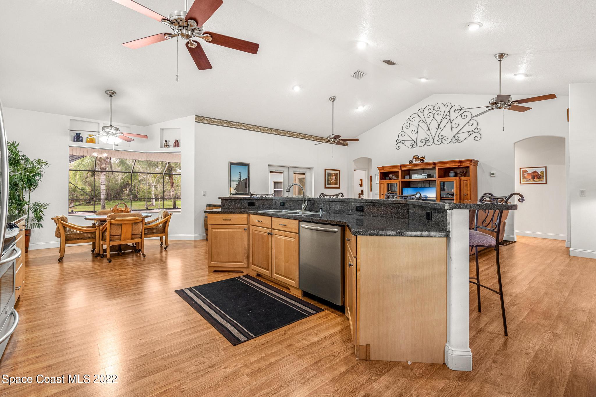 3970 Harlock Road Melbourne, FL 32934 - Photo 8 of 30 a kitchen with a sink cabinets and window