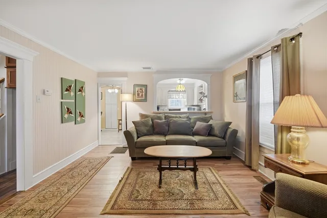 a living room with furniture and a rug