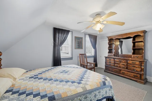 a bedroom with a bed and a dresser