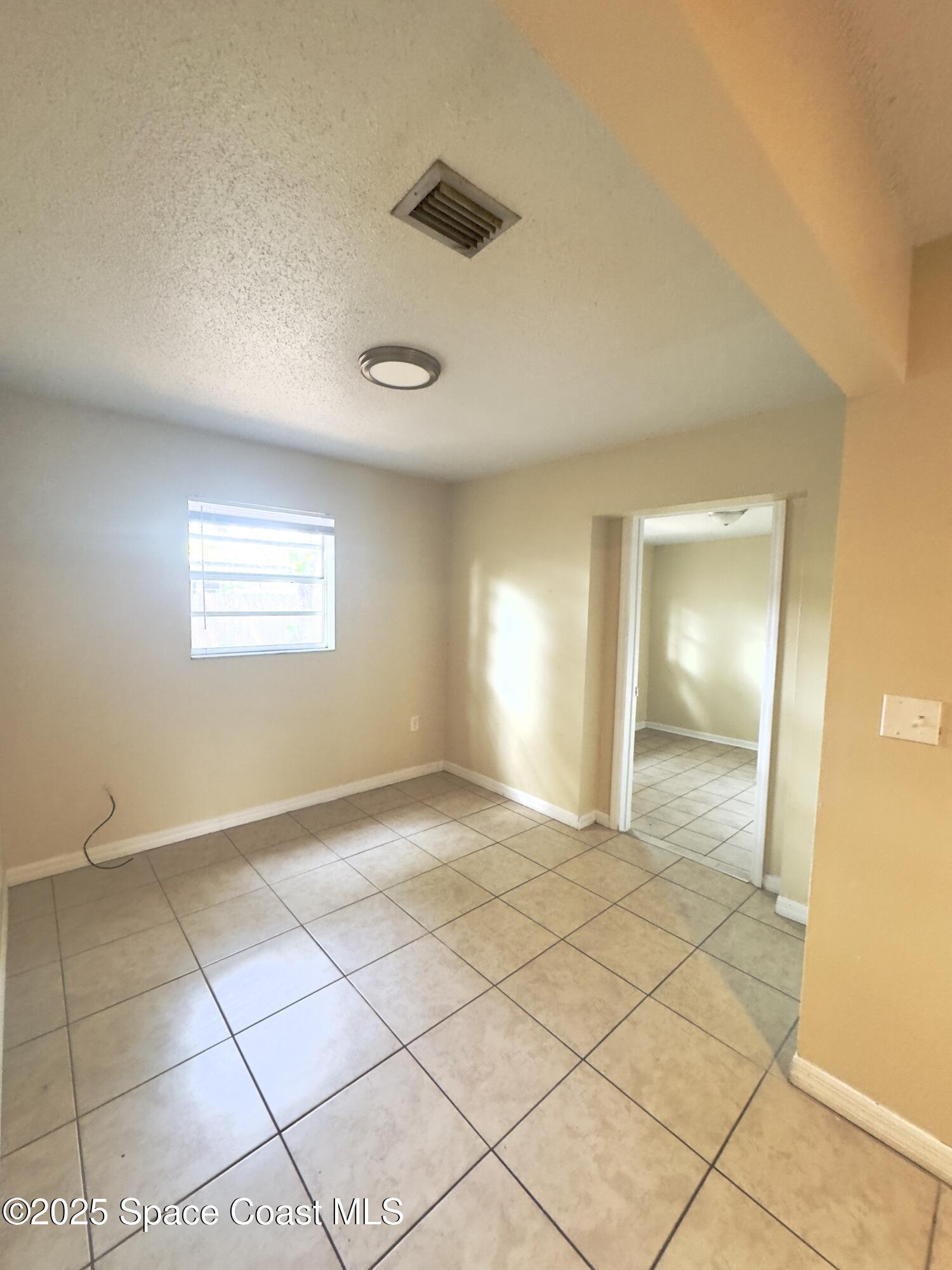 2466 Uranus Drive Cocoa, FL 32926 - Photo 16 of 20 a view of an empty room and window