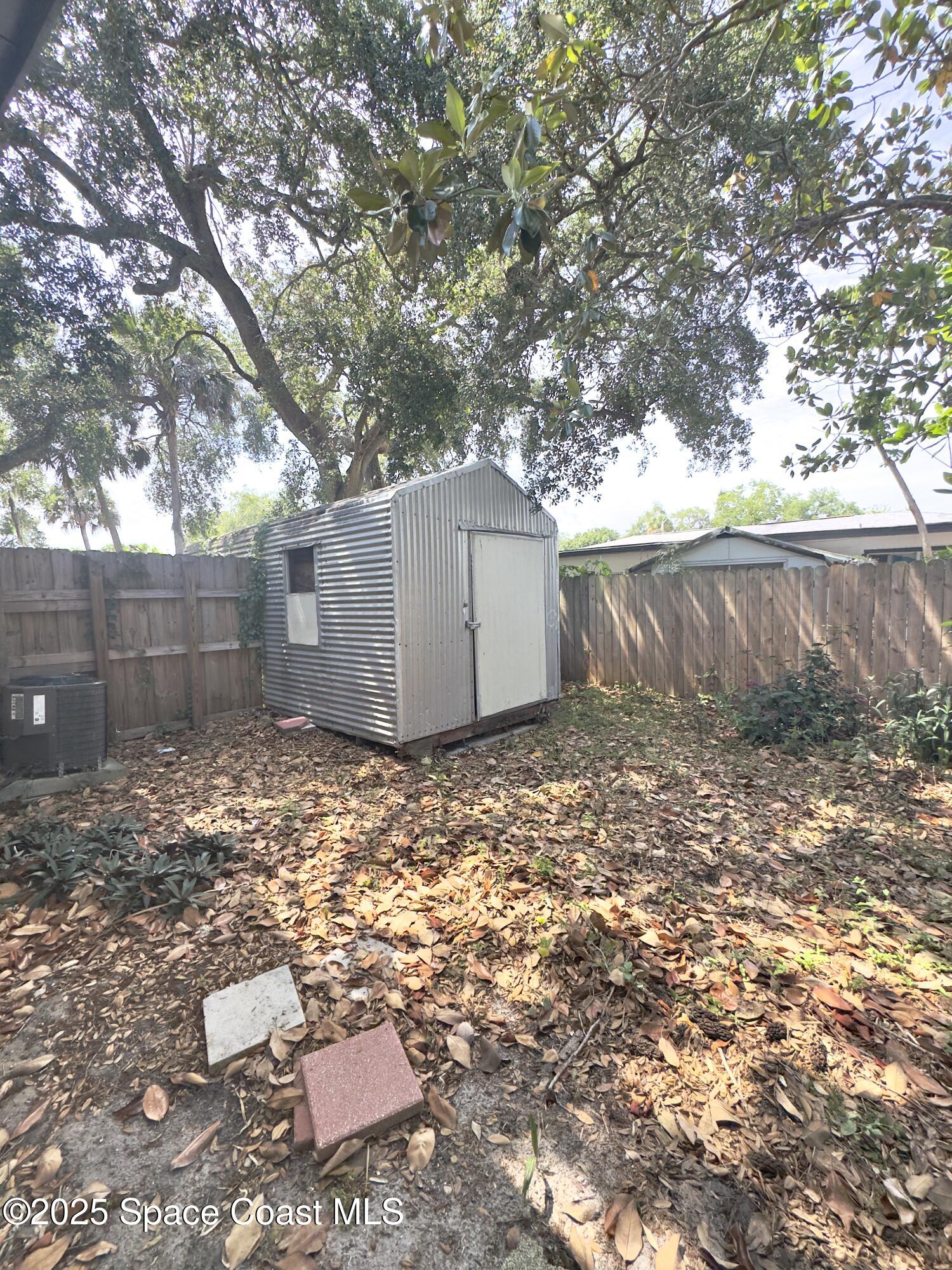 2466 Uranus Drive Cocoa, FL 32926 - Photo 19 of 20 a backyard of a house