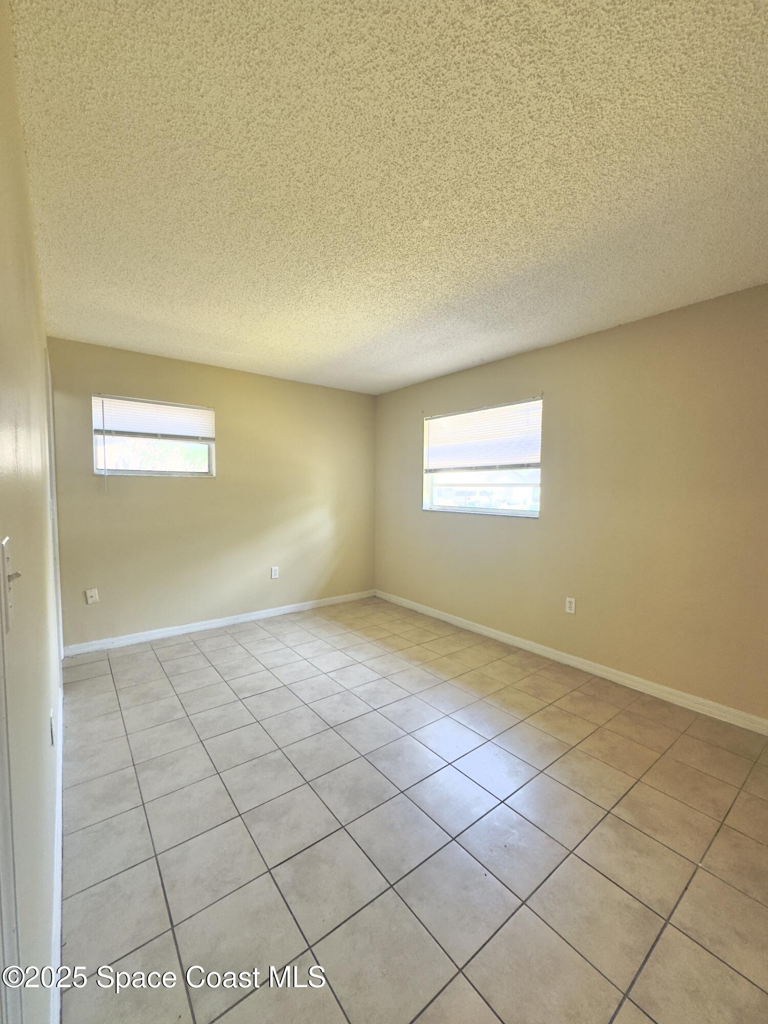 2466 Uranus Drive Cocoa, FL 32926 - Photo 8 of 20 a view of an empty room and window
