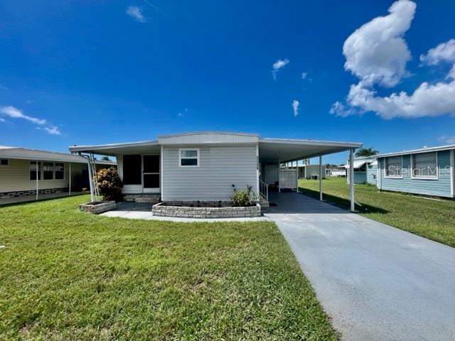 10819 London Drive Port Richey, FL 34668 - Photo 2 of 52 a view of a house with backyard and sitting area