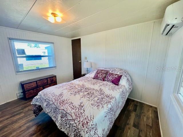 10819 London Drive Port Richey, FL 34668 - Photo 29 of 52 a bedroom with a bed and a painting on the wall