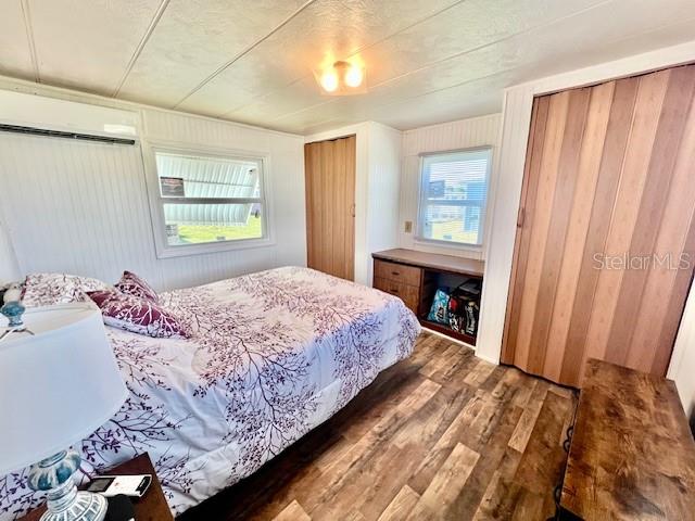 10819 London Drive Port Richey, FL 34668 - Photo 30 of 52 a bedroom with a bed and a window