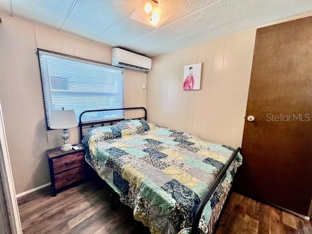 10819 London Drive Port Richey, FL 34668 - Photo 31 of 52 a bedroom with a bed and a window