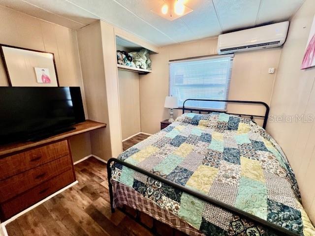 10819 London Drive Port Richey, FL 34668 - Photo 32 of 52 a bed sitting in a bedroom next to a window with pc on the table