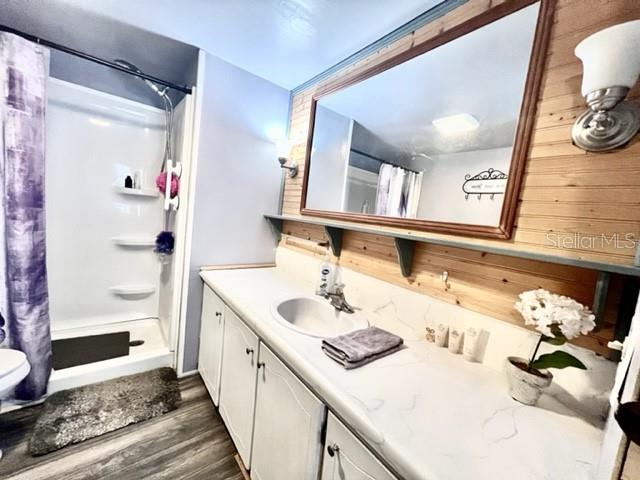 10819 London Drive Port Richey, FL 34668 - Photo 34 of 52 a bathroom with a sink and a mirror