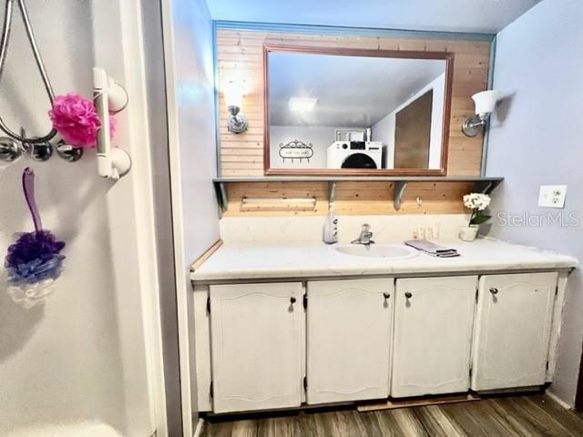 10819 London Drive Port Richey, FL 34668 - Photo 35 of 52 a bathroom with a sink and a mirror