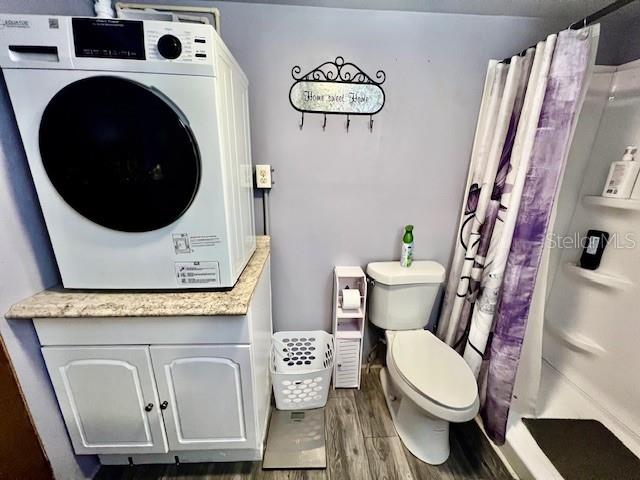 10819 London Drive Port Richey, FL 34668 - Photo 36 of 52 a bathroom with a toilet a sink and a mirror