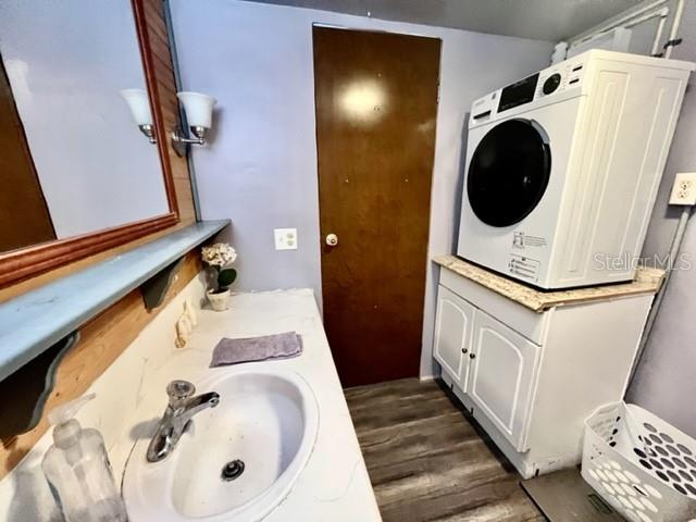 10819 London Drive Port Richey, FL 34668 - Photo 37 of 52 a bathroom with a sink a toilet and shower