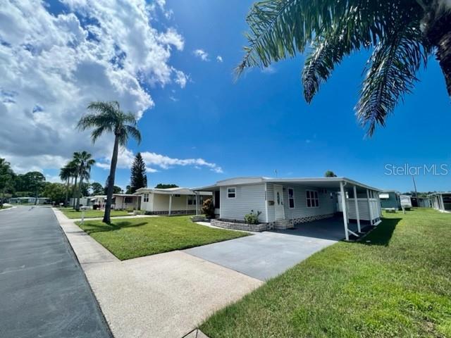 10819 London Drive Port Richey, FL 34668 - Photo 42 of 52 a view of yard with swimming pool and green space