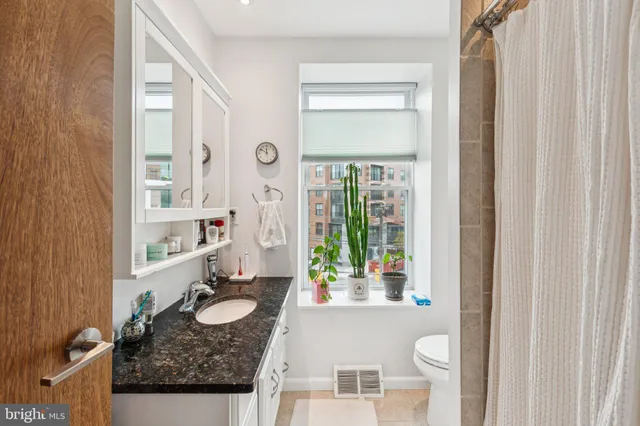 a room with furniture and a window