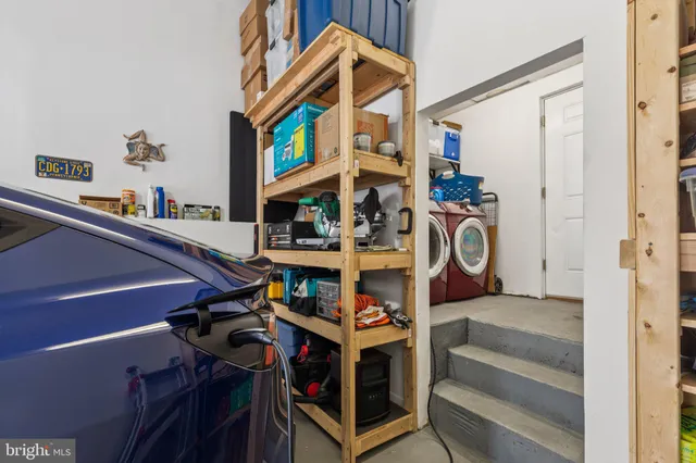a view of a car parked on the side of a street