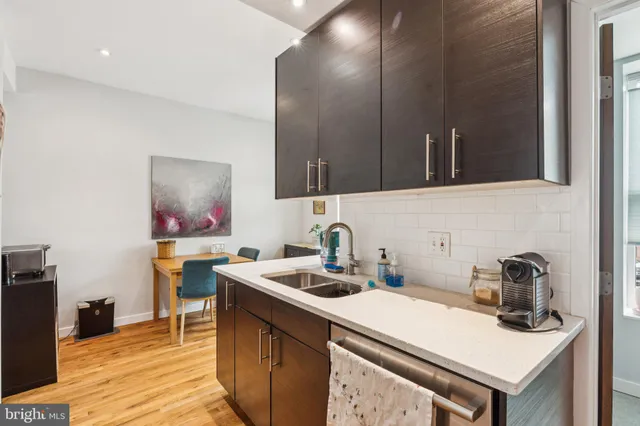 a kitchen with a sink and cabinets