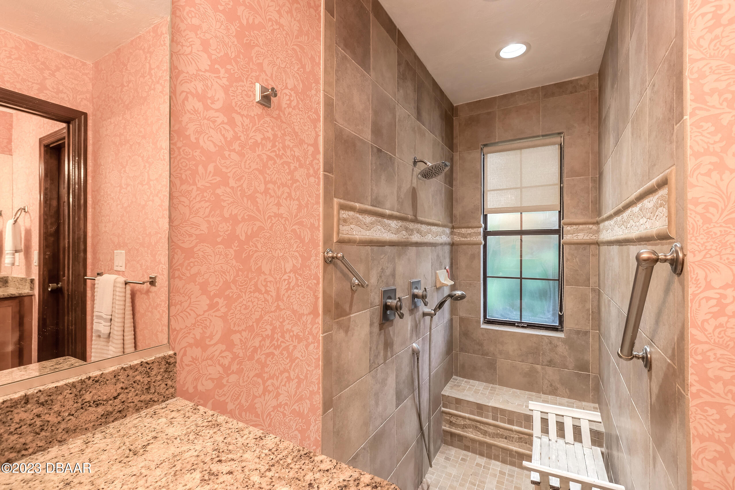 16 Eagle Court Ormond Beach, FL 32174 - Photo 11 of 50 a bathroom with a tub shower and a sink