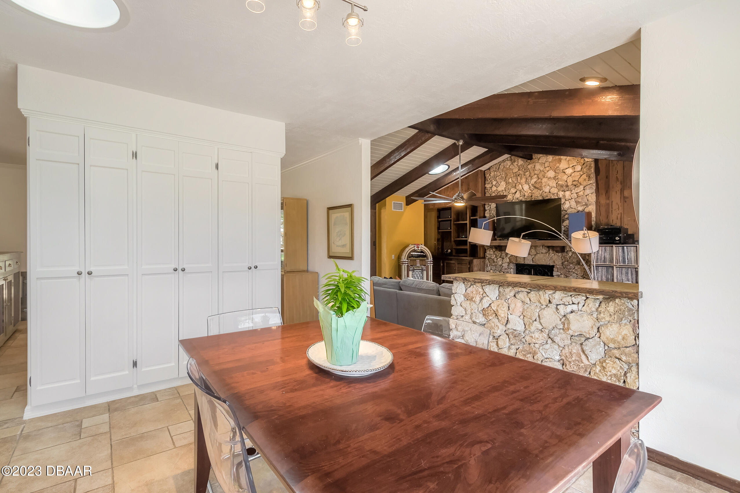 16 Eagle Court Ormond Beach, FL 32174 - Photo 13 of 50 a view of a dining room with furniture and a potted plant