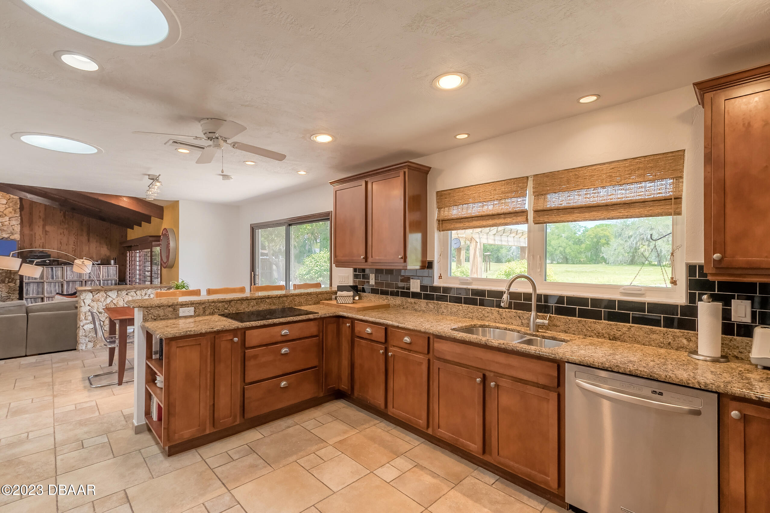 16 Eagle Court Ormond Beach, FL 32174 - Photo 14 of 50 a kitchen with lots of counter top space sink and center island