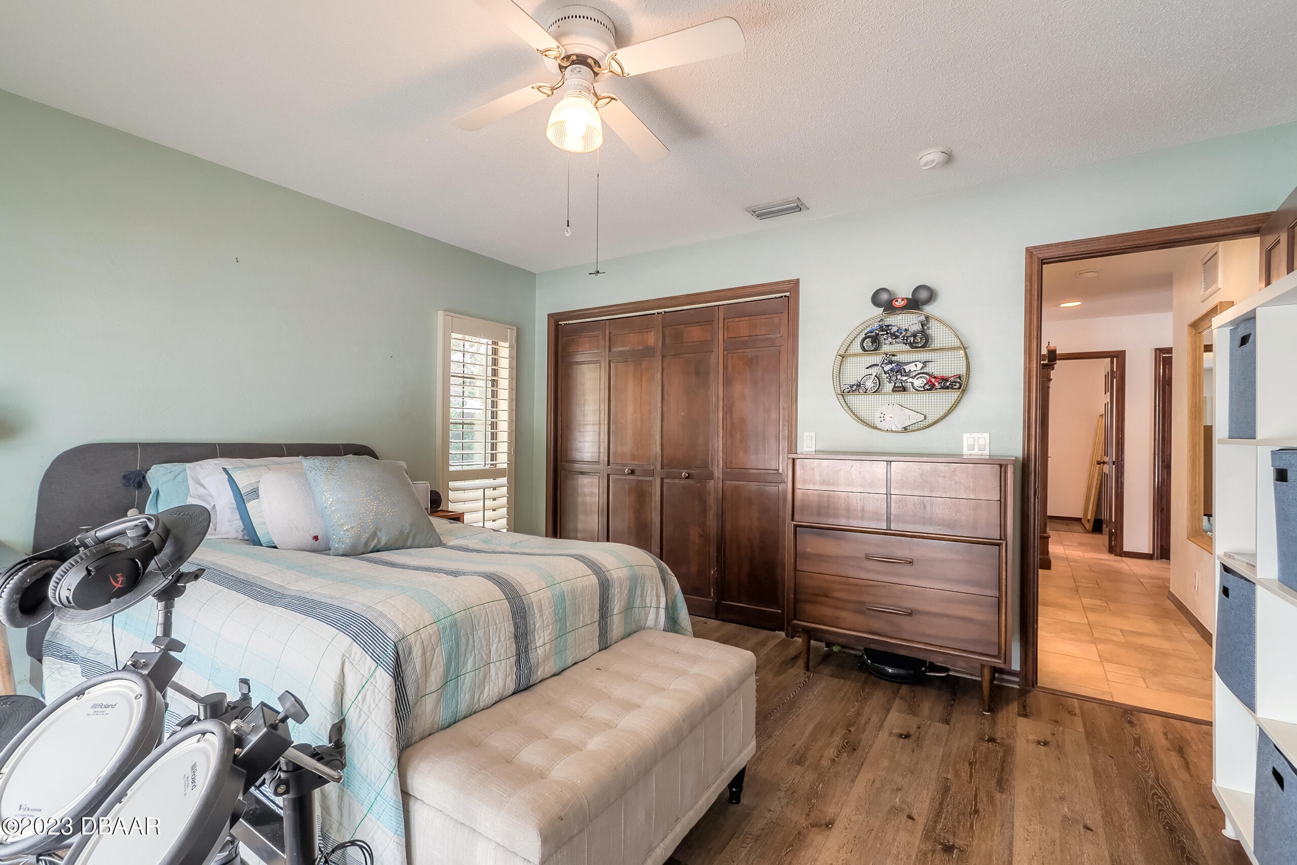 16 Eagle Court Ormond Beach, FL 32174 - Photo 25 of 50 a bedroom with a bed and wooden floor