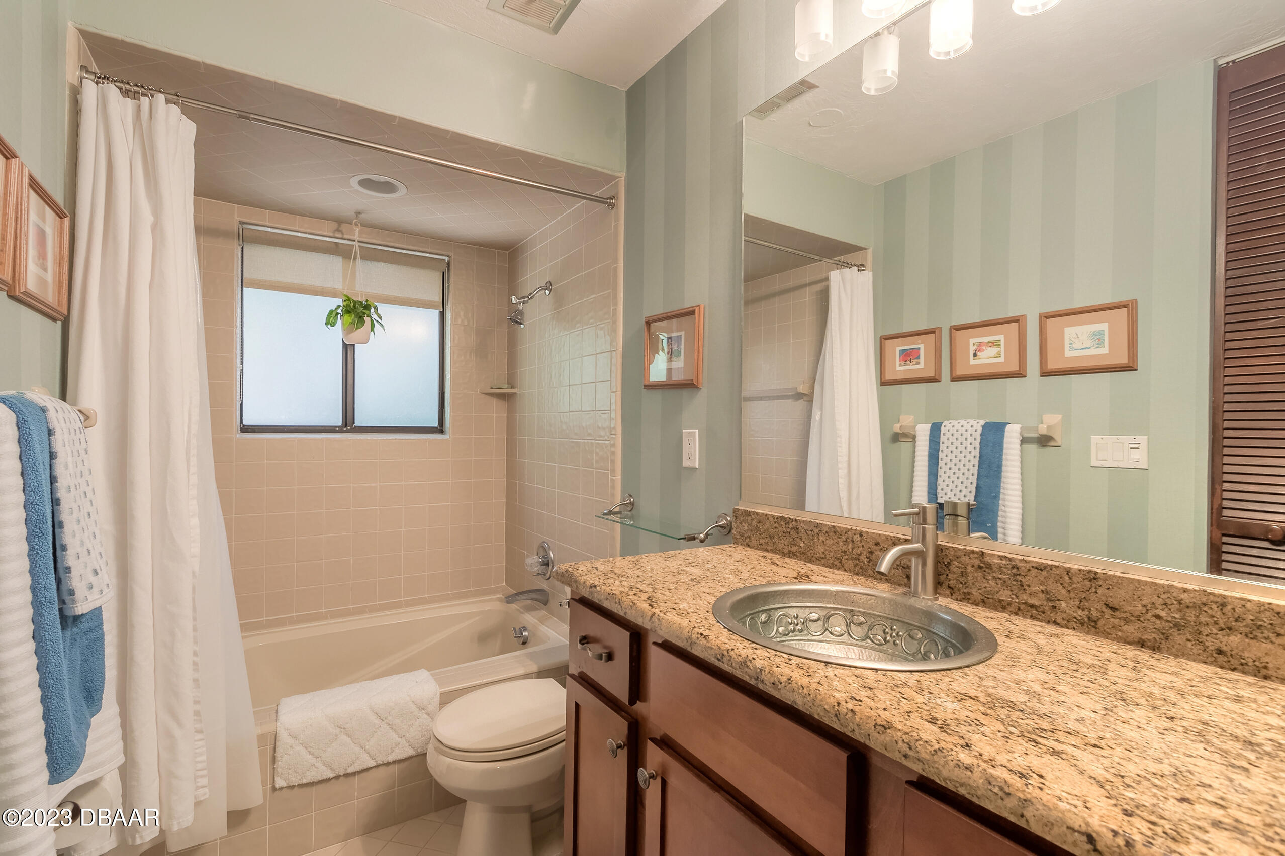 16 Eagle Court Ormond Beach, FL 32174 - Photo 26 of 50 a bathroom with a granite countertop sink and a mirror