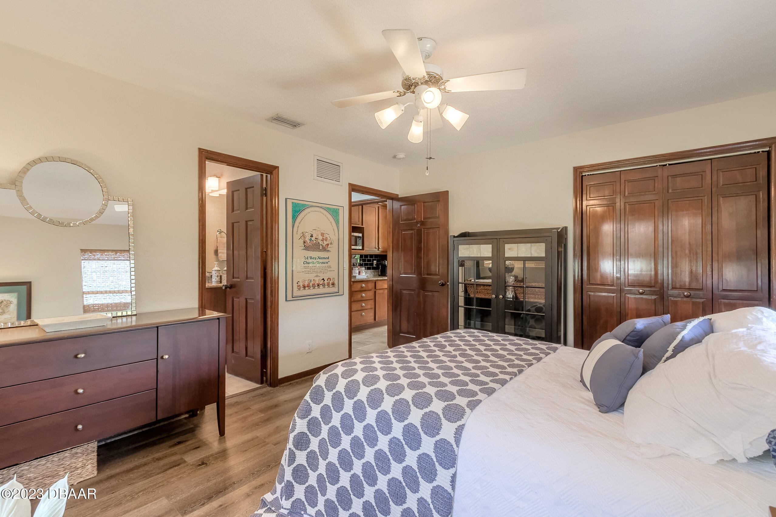 16 Eagle Court Ormond Beach, FL 32174 - Photo 28 of 50 a bedroom with a bed and wooden floor