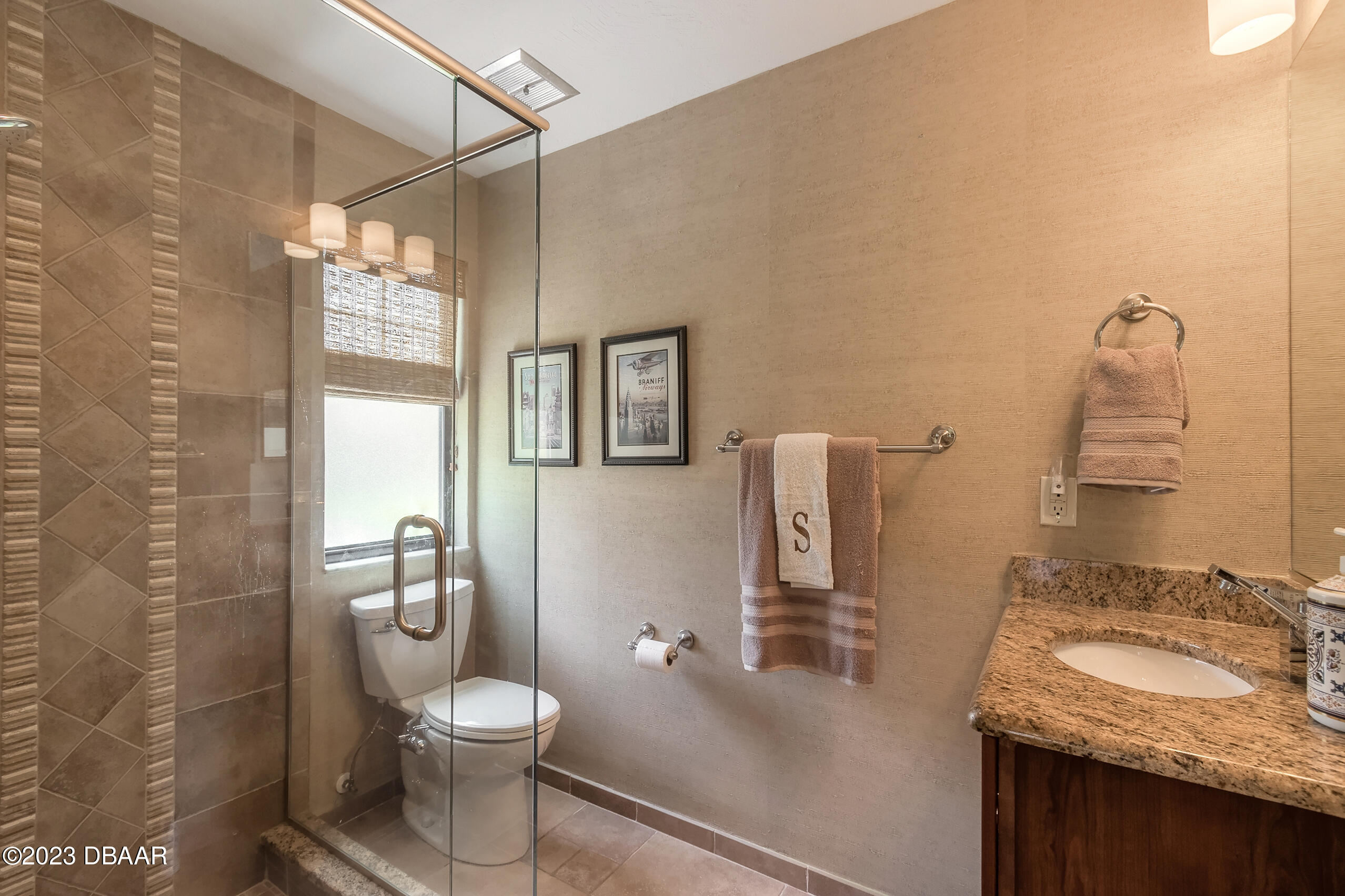 16 Eagle Court Ormond Beach, FL 32174 - Photo 29 of 50 a bathroom with a granite countertop sink toilet and shower