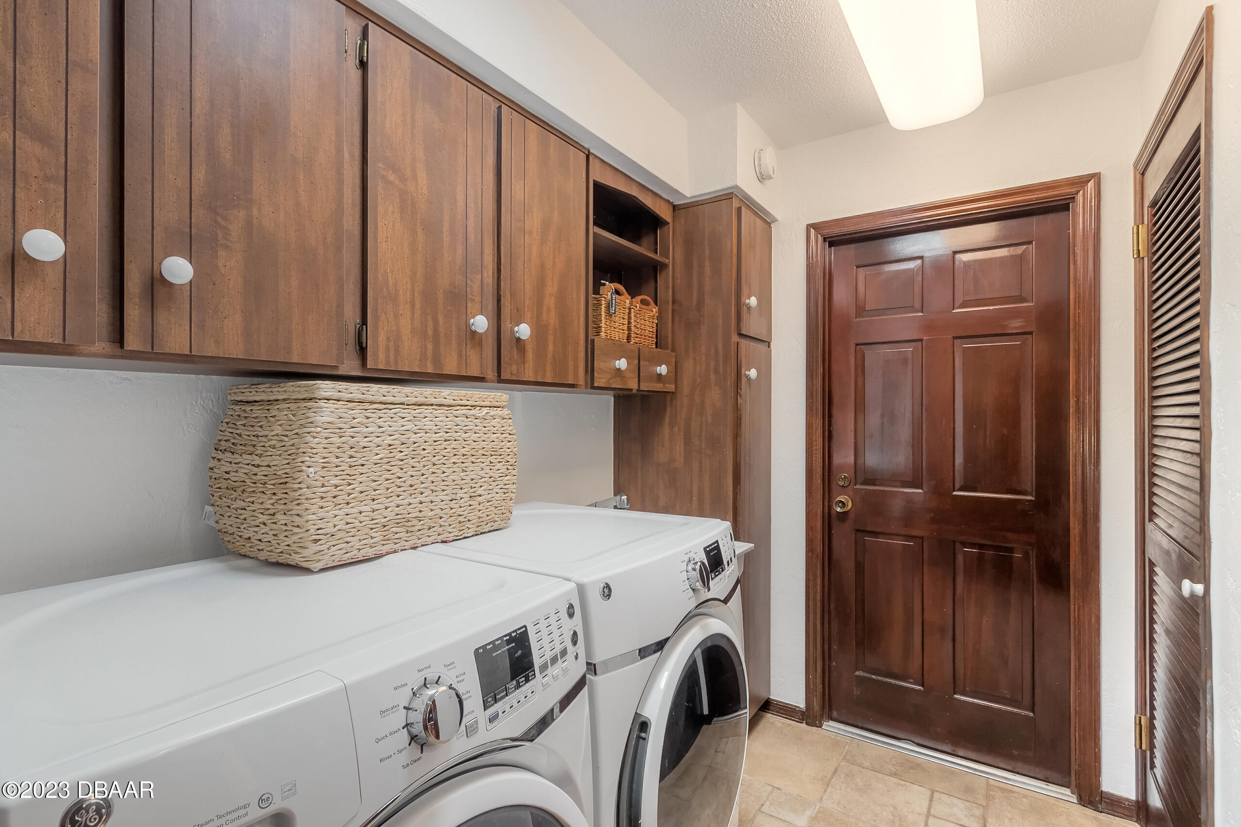 16 Eagle Court Ormond Beach, FL 32174 - Photo 30 of 50 a utility room with dryer and washer