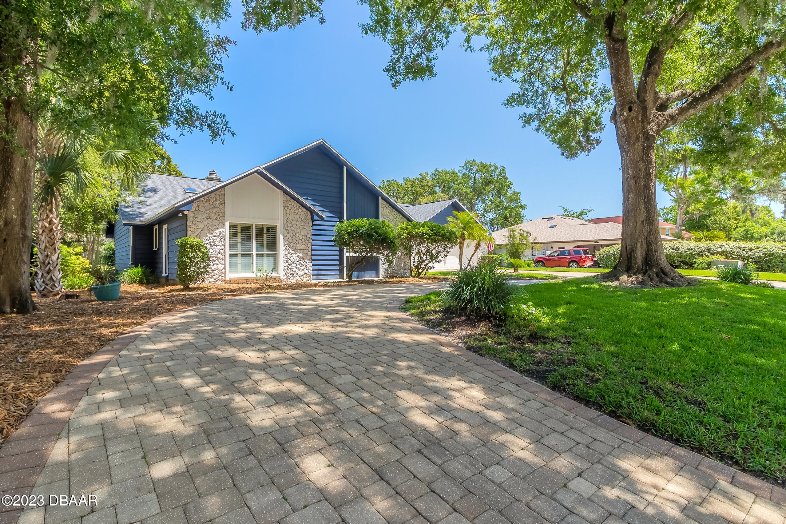 16 Eagle Court Ormond Beach, FL 32174 - Photo 31 of 50 a front view of a house with garden