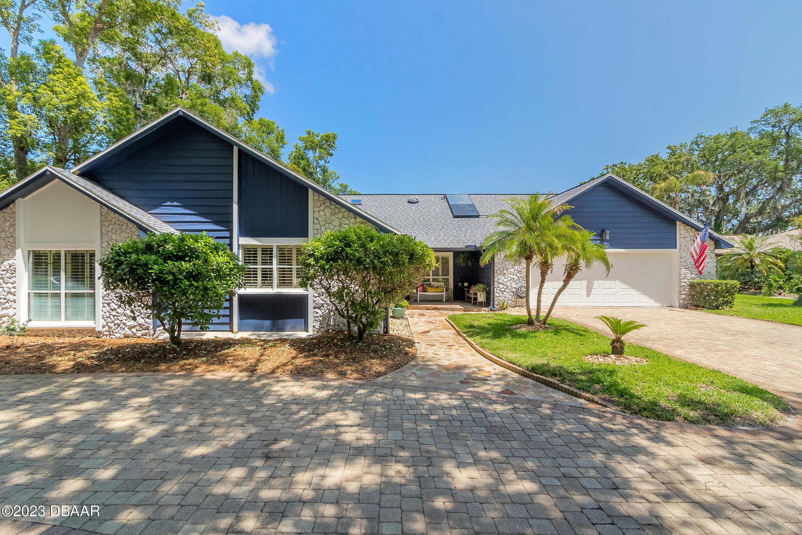 16 Eagle Court Ormond Beach, FL 32174 - Photo 33 of 50 a view of a house with a yard and potted plants