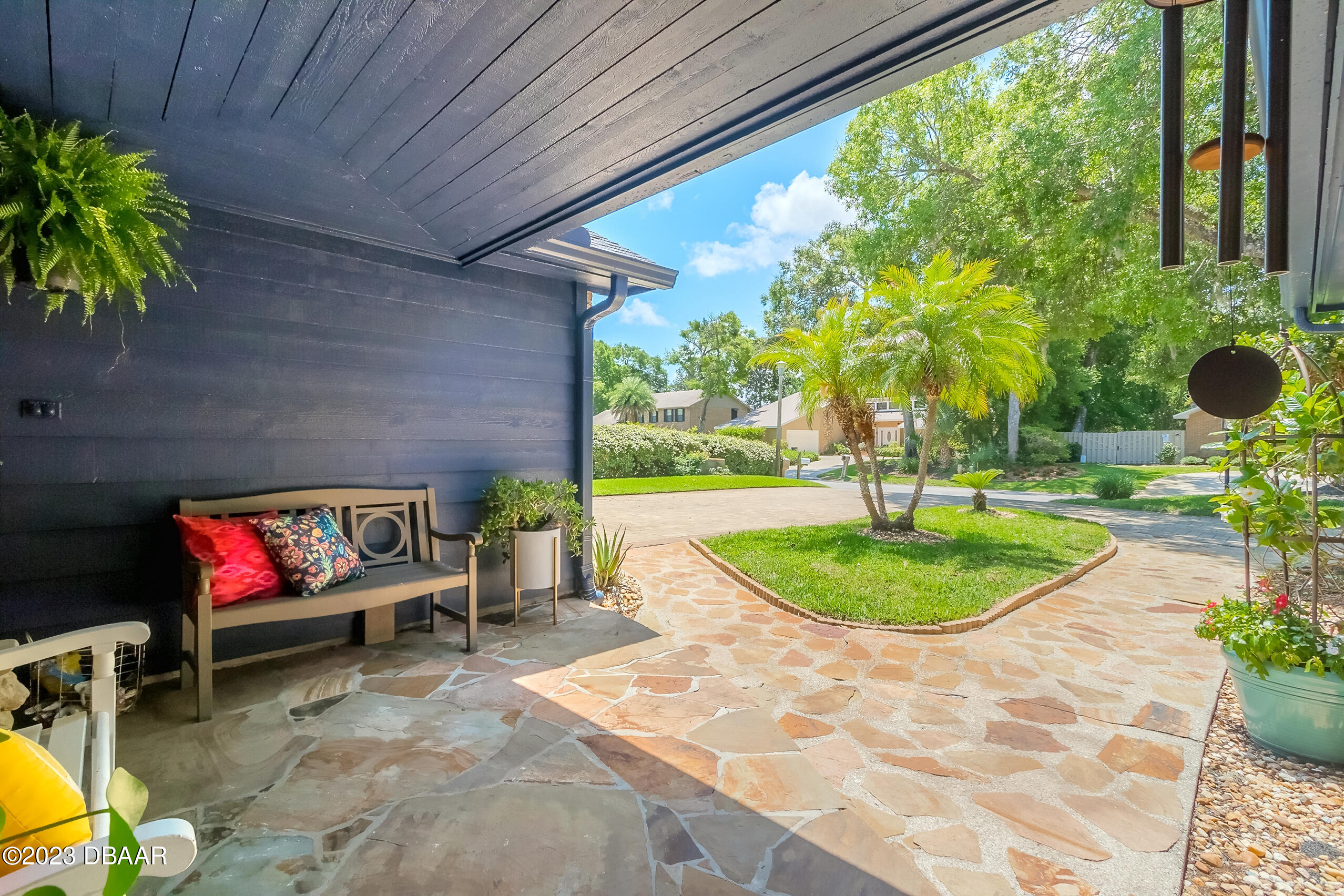 16 Eagle Court Ormond Beach, FL 32174 - Photo 35 of 50 a backyard of a house with outdoor seating