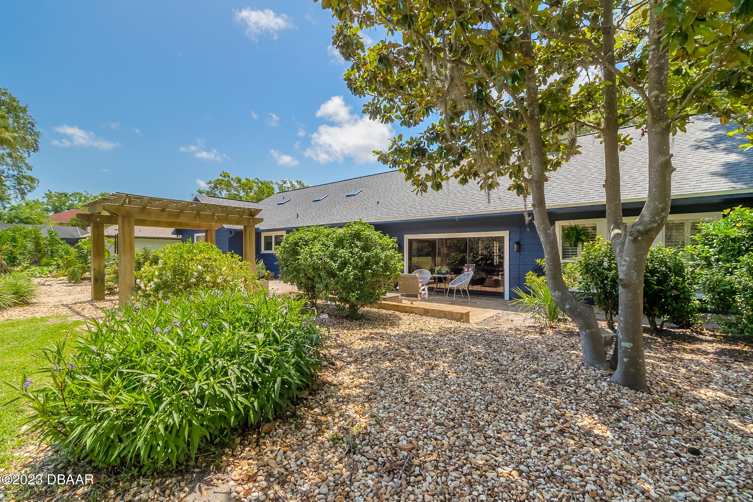 16 Eagle Court Ormond Beach, FL 32174 - Photo 39 of 50 a front view of a house with garden