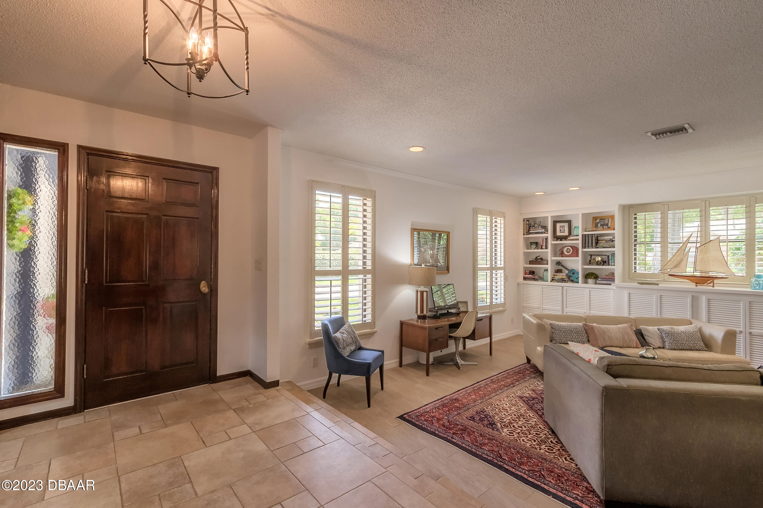 16 Eagle Court Ormond Beach, FL 32174 - Photo 4 of 50 a living room with furniture and windows