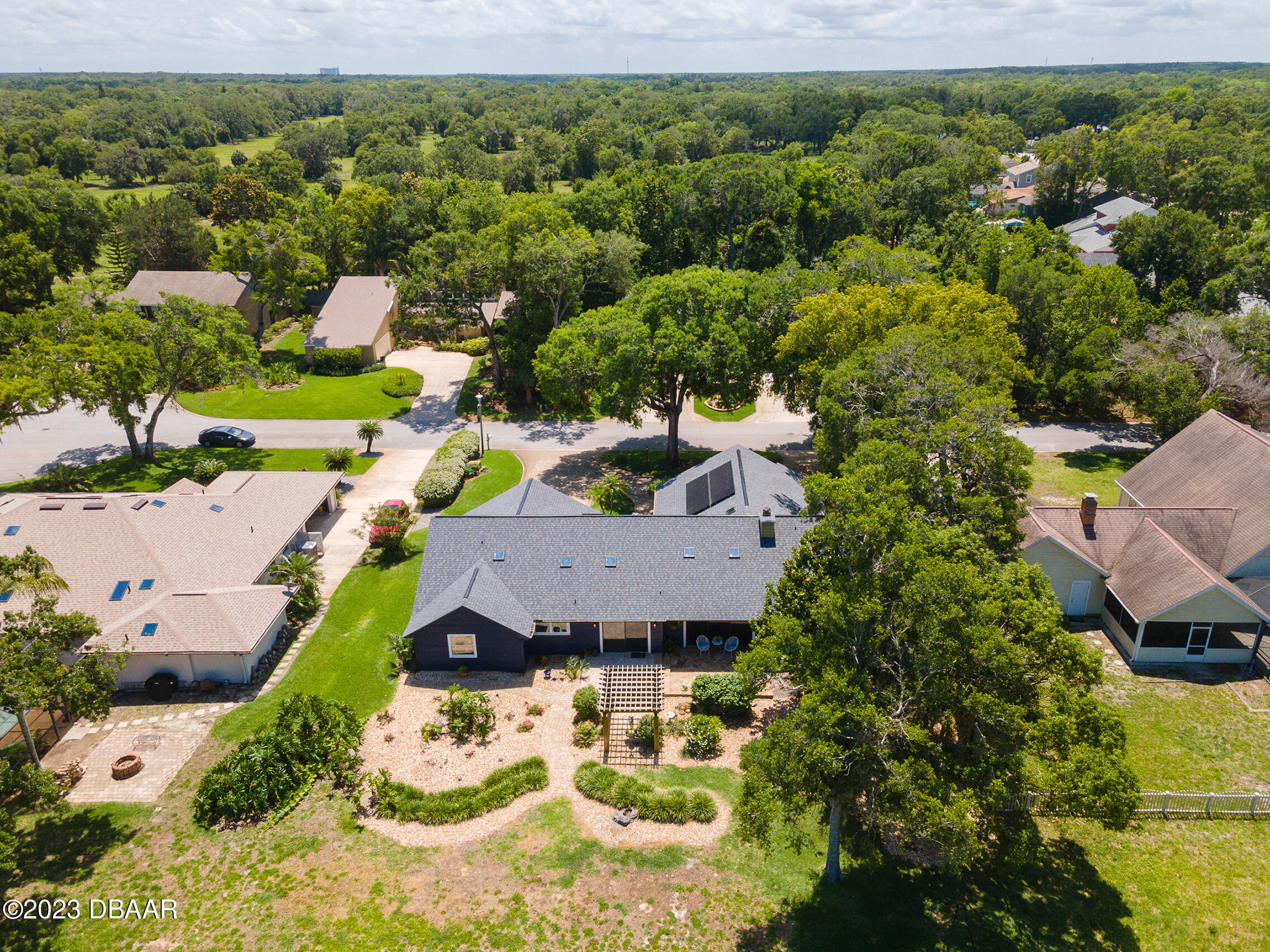 16 Eagle Court Ormond Beach, FL 32174 - Photo 47 of 50 an aerial view of a house with a garden and lake view