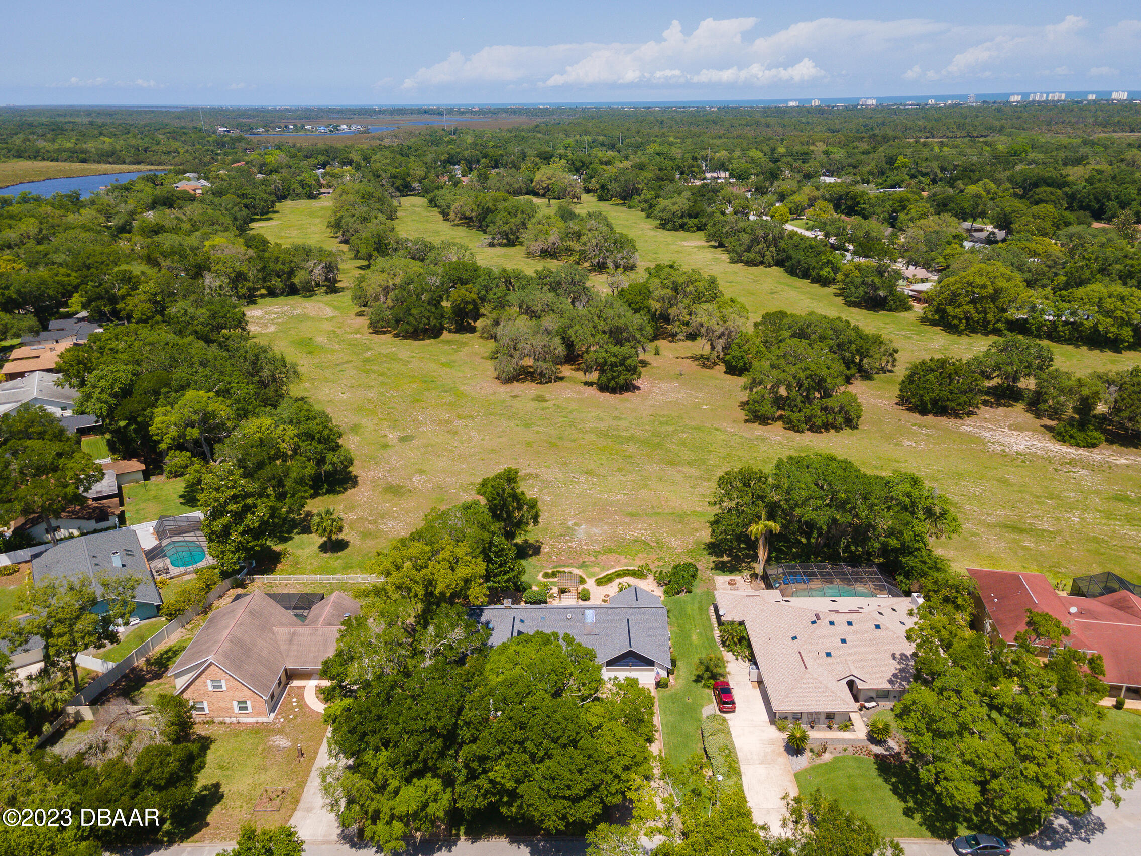 16 Eagle Court Ormond Beach, FL 32174 - Photo 50 of 50 an aerial view of residential houses with outdoor space and trees