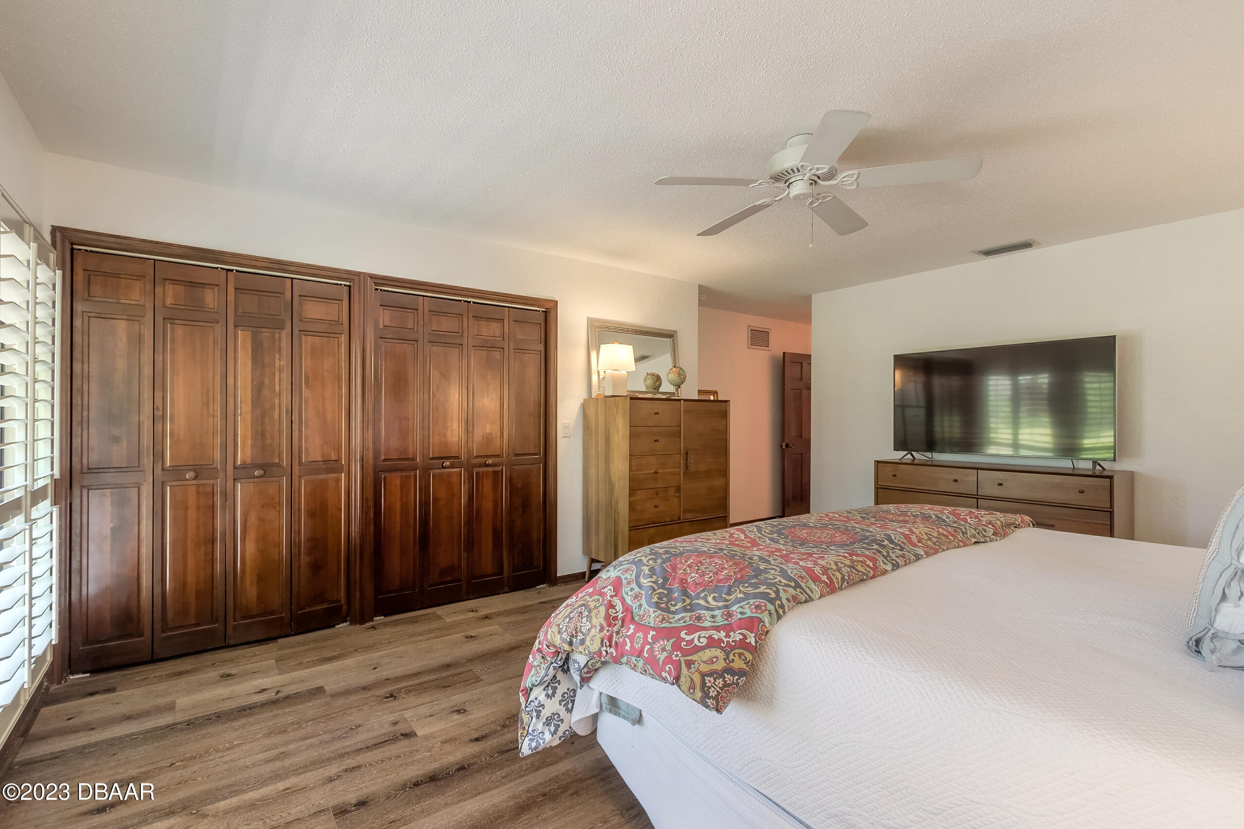 16 Eagle Court Ormond Beach, FL 32174 - Photo 8 of 50 a bedroom with a large bed a flat tv screen and dresser