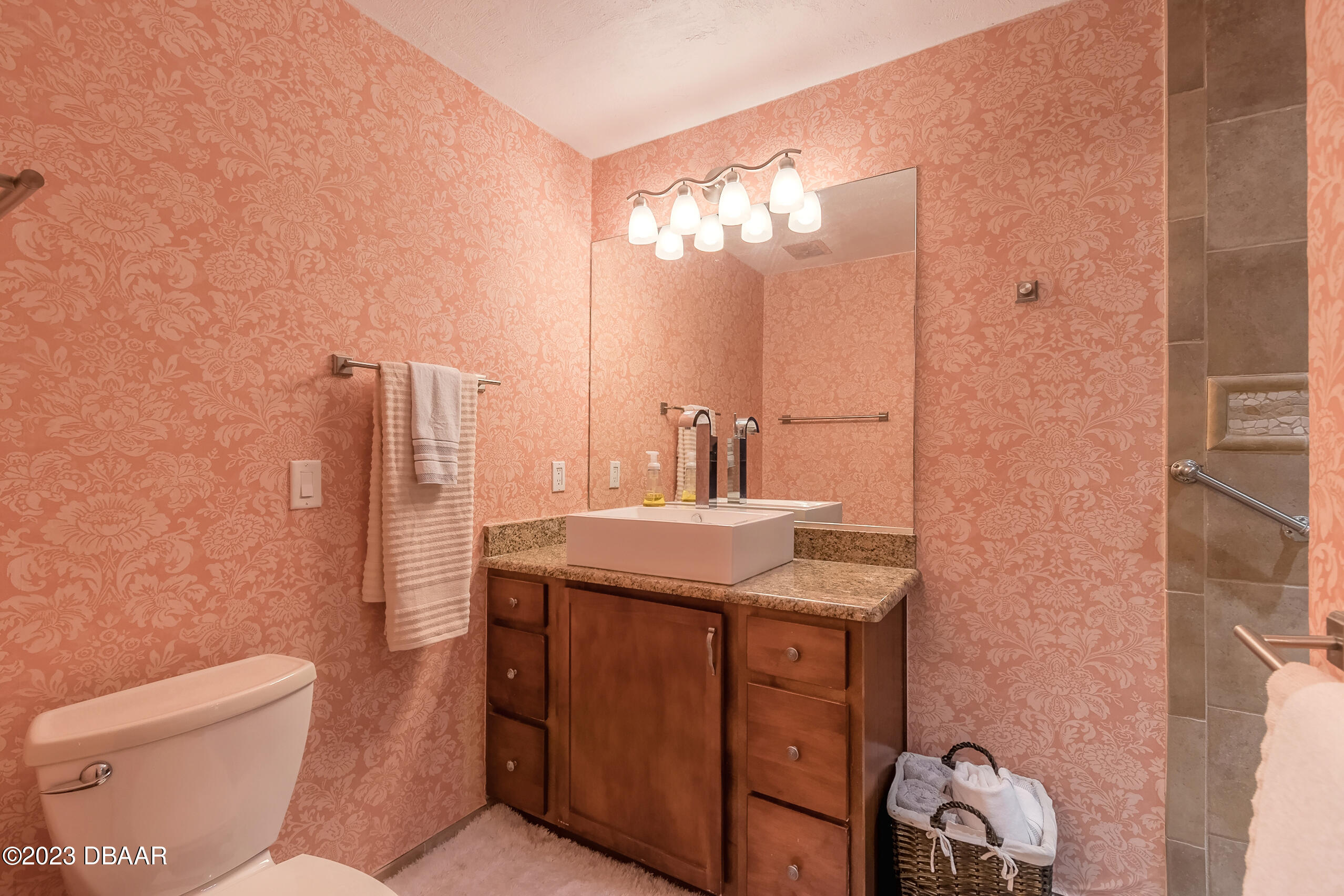 16 Eagle Court Ormond Beach, FL 32174 - Photo 10 of 50 a bathroom with a sink a toilet and shower