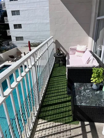 a view of a back yard of the house is sitting area