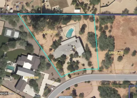 an aerial view of a house with a lake view