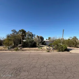 a view of a road with a building in the background