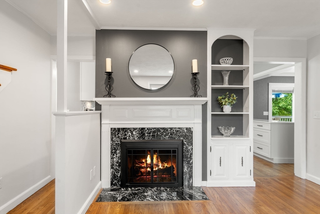 37 Benjamin Road Marlborough, MA 01752 - Photo 12 of 39 a living room with a fireplace and a table