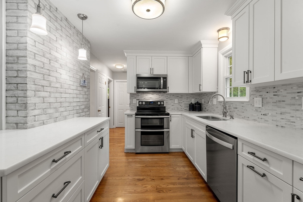 37 Benjamin Road Marlborough, MA 01752 - Photo 16 of 39 a kitchen with granite countertop a stove sink and cabinets