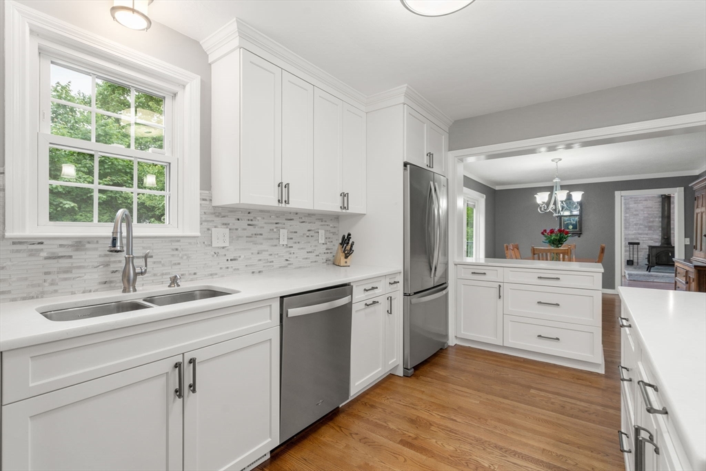 37 Benjamin Road Marlborough, MA 01752 - Photo 17 of 39 a kitchen with white cabinets and white appliances