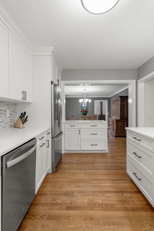 37 Benjamin Road Marlborough, MA 01752 - Photo 19 of 39 a kitchen with stainless steel appliances kitchen island granite countertop a refrigerator and a stove top oven